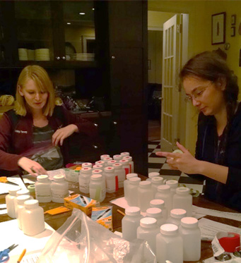 two graduate students working with water collection kits