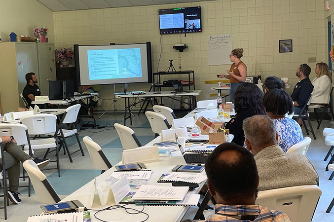 Judith Taylor sharing a presentation and leading and indoor workshop