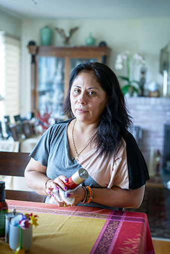 woman cleaning a household item