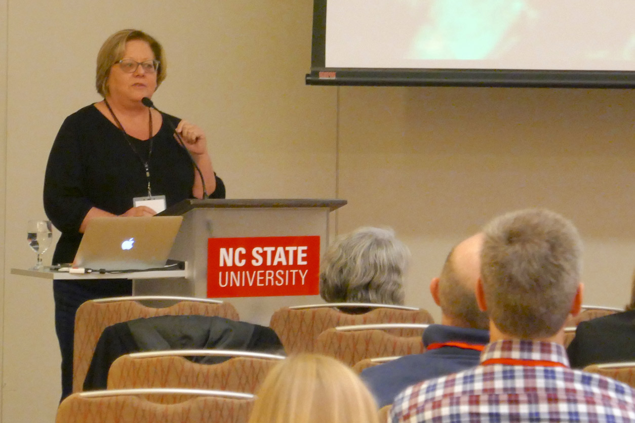 Patricia Jensen, Ph.D. speaks from the podium
