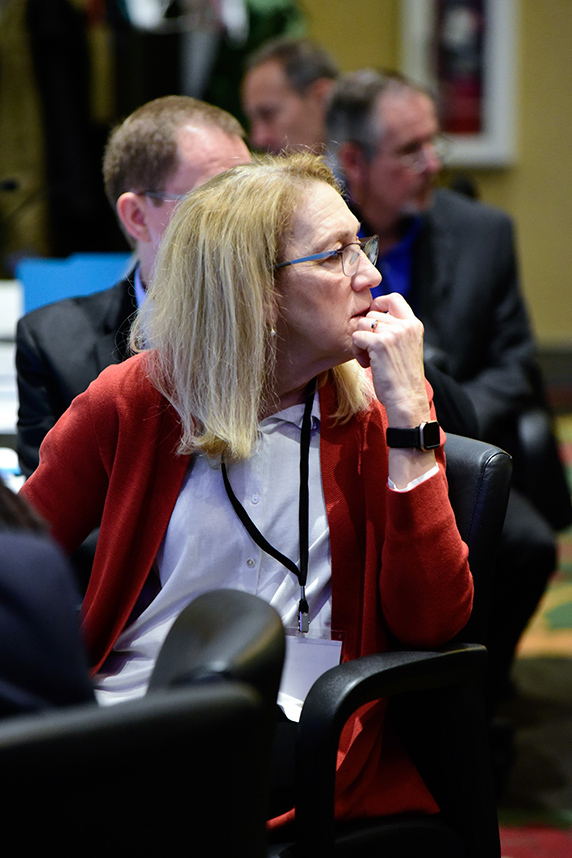 Lynn Goldman, M.D. seated and looking to the right