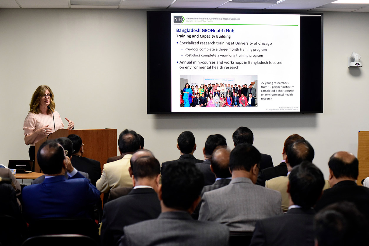 Kimberly Gray, Ph.D. stands at podium and speaks to audience
