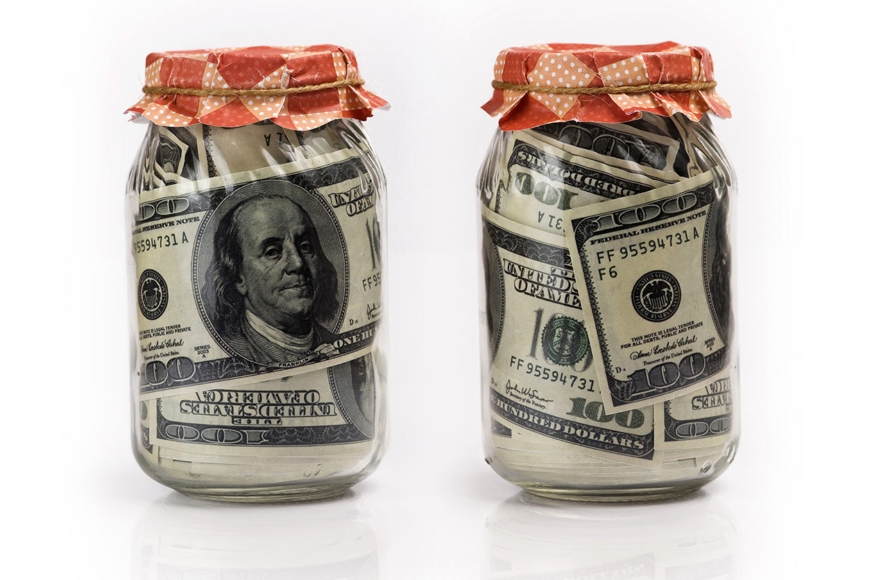 2 glass jars filled with $100 bills