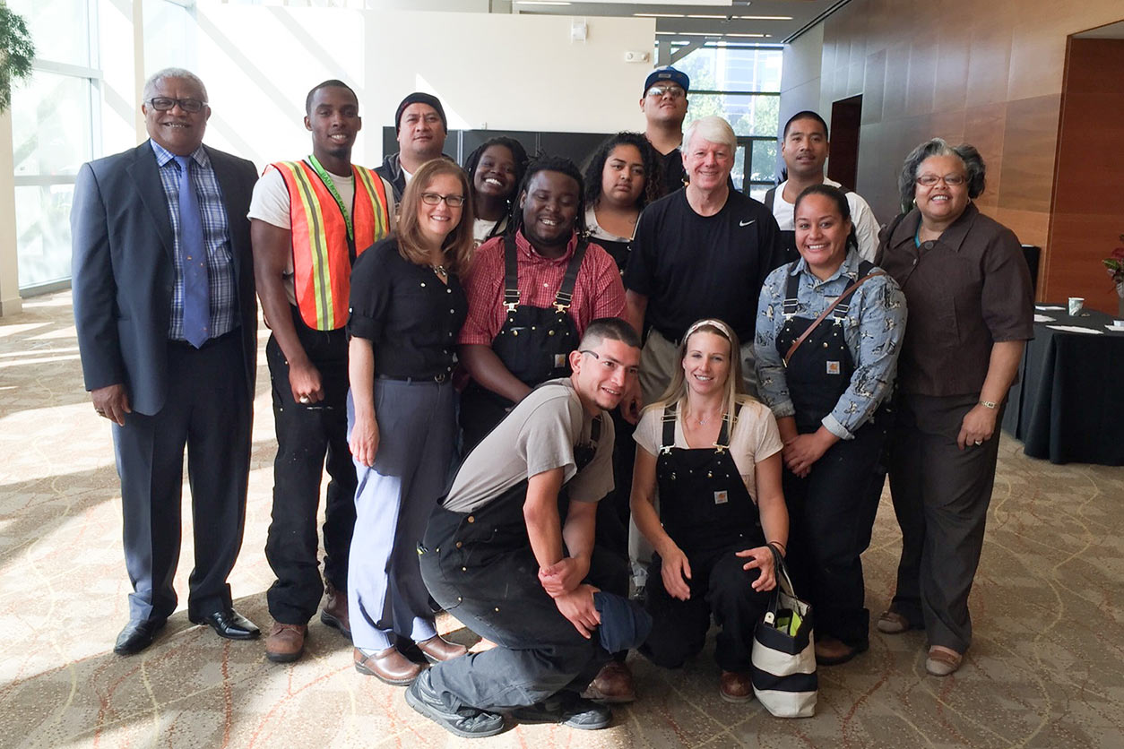 JobTrain participants, WTP Director Joseph "Chip" Hughes and WTP Public Health Educator Demia Wright pose for a group photo
