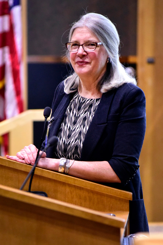 Cheryl Walker stands at a podium