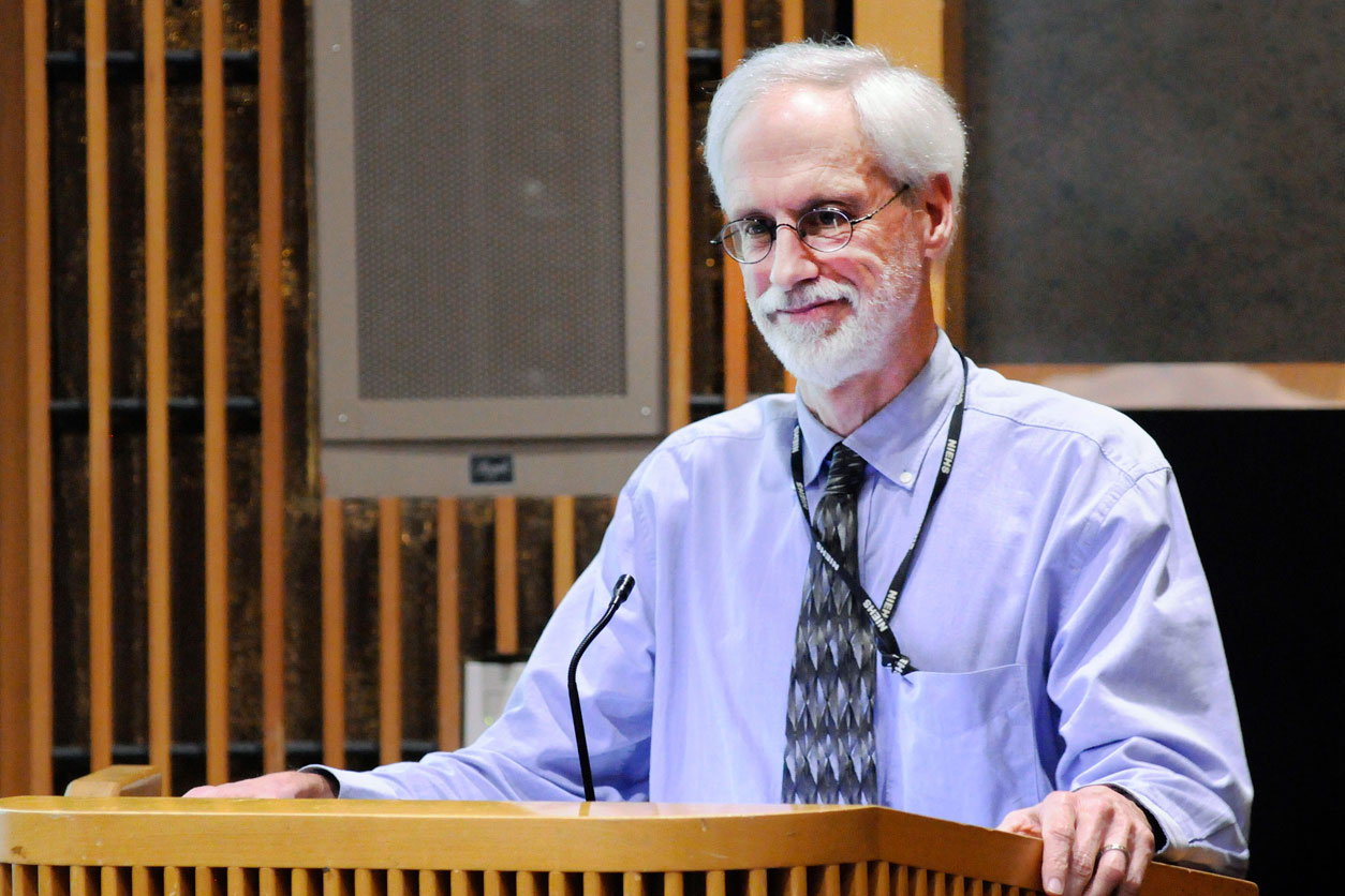 John Bucher stands at a podium