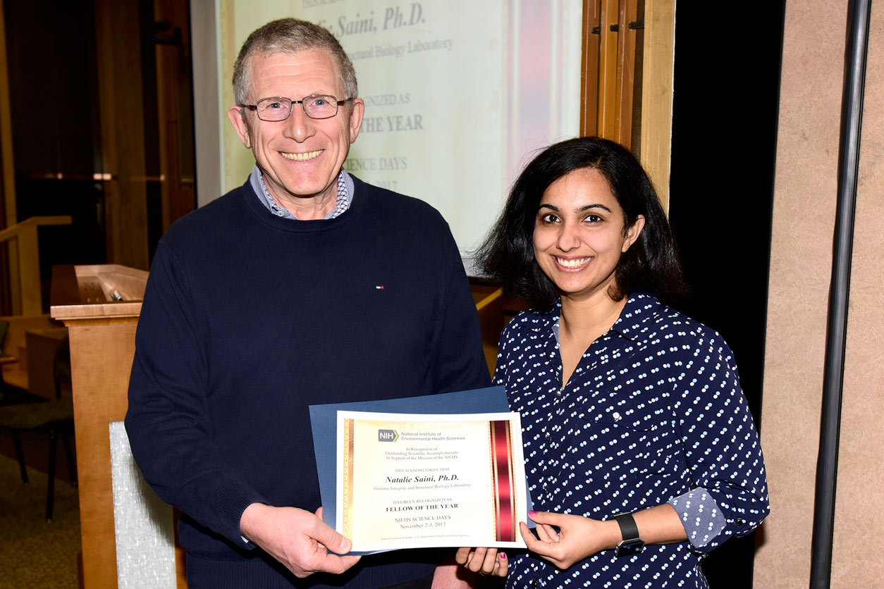 Dmitry Gordenin and Natalie Saini holding 2017 NIEHS Fellow of the Year certificate