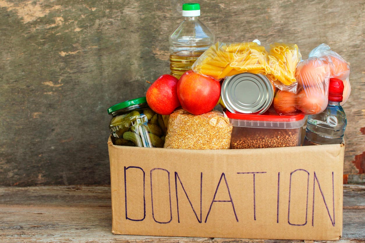 box containing food items labeled as DONATION