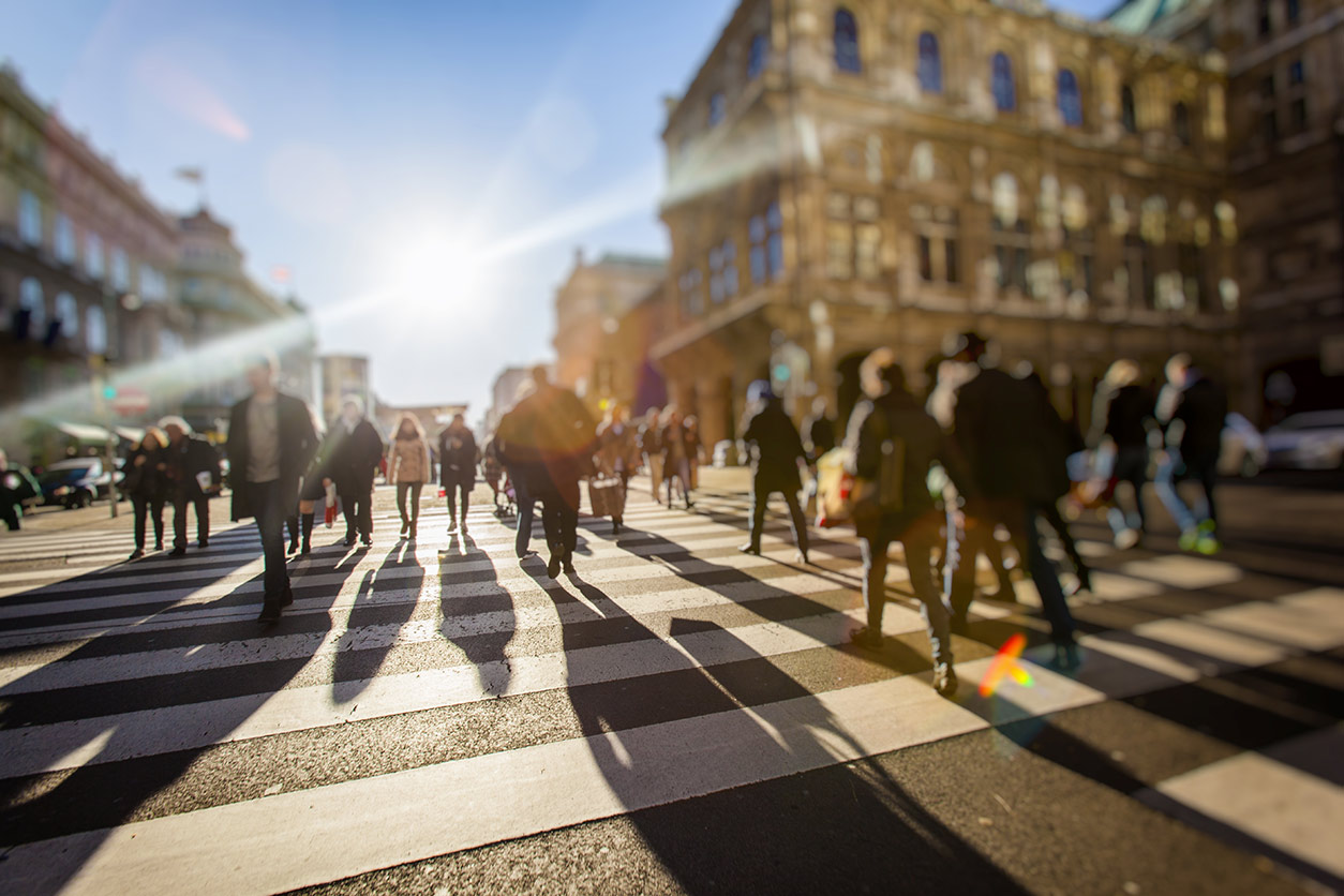 people walking in a crosswalk