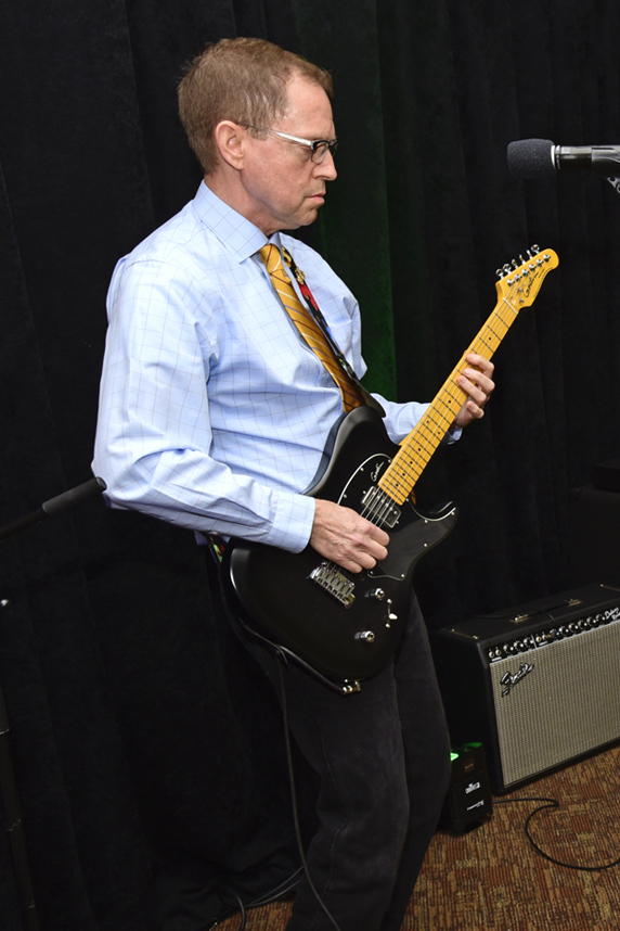 Chris Long playing guitar