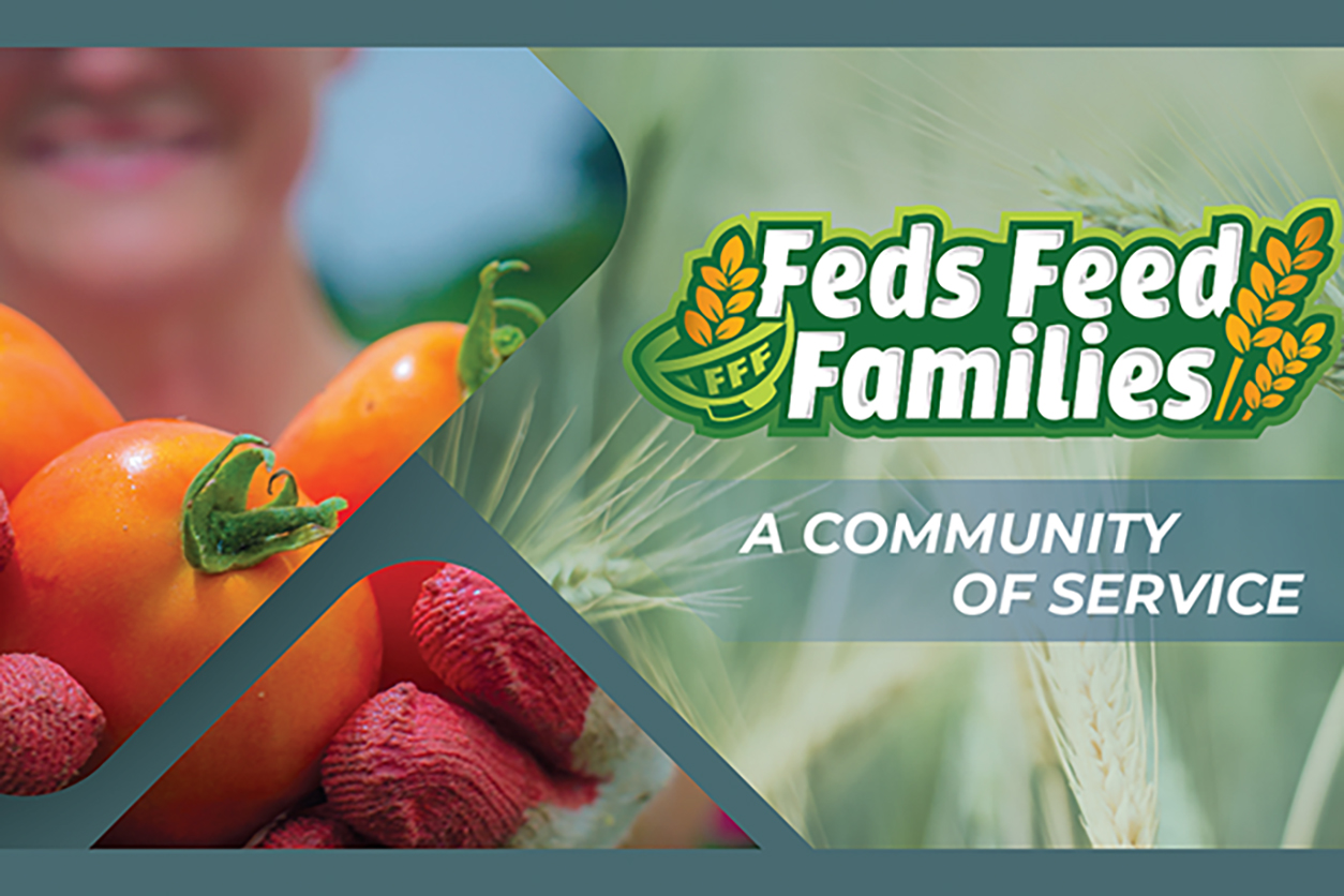 Hands holding orange peppers with Feds Feed Familys - A Community Service
