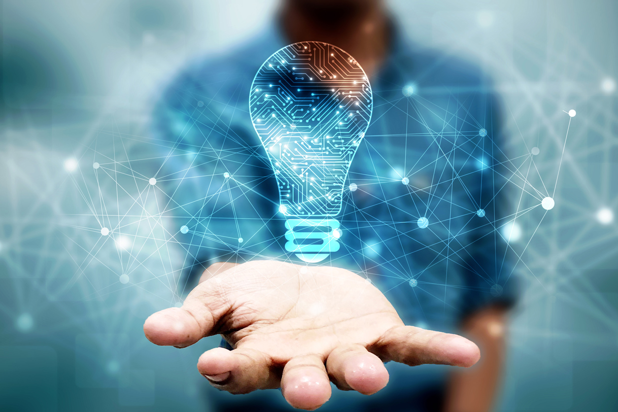 Hand with an illustrated light bulb floating over it